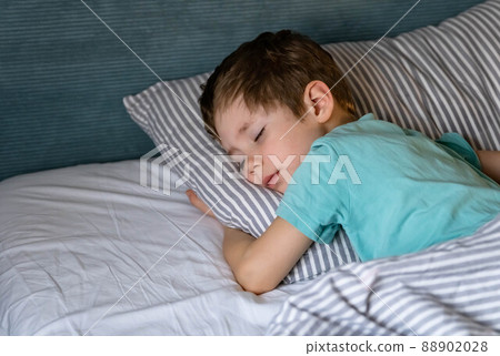 Sleeping child in bed. Little baby napping in the nursery. Sleeping child in bed. Little baby napping in the nursery. 88902028