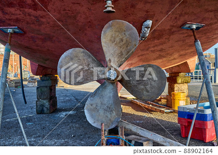 The propeller of a ship in dry dock 88902164