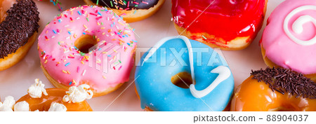 sweet doughnuts on gray stone background 88904037