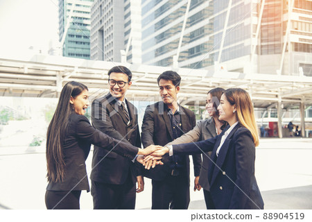 Group of diversity people fist bump holding hands together power of tag team. Teamwork Multiethnic people group working togetherness. Business people team holding hands successful. Business meeting 88904519