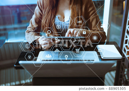 Businesswoman hand working digital marketing media in virtual screen with mobile phone and modern compute with VR icon diagram at office 88905305