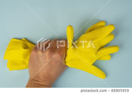 a yellow rubber cleaning glove 88905959