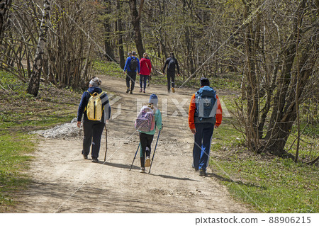 Young Group of people walking by hiking trail Young Group of people walking by hiking trail 88906215