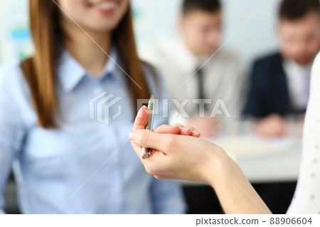 Focus on beautiful woman arm holding writing pen. Focus on beautiful woman arm holding writing pen. 88906604