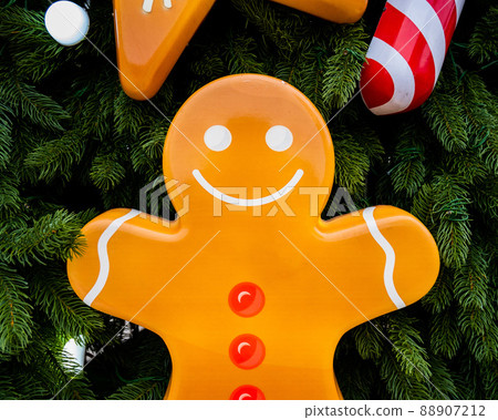 Close-up of decorations on the Christmas tree. Mister gingerbread. Close-up of decorations on the Christmas tree. Mister gingerbread. 88907212