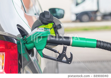gas pump nozzle at gas station, filling the car with petrol at a petrol station 88908040