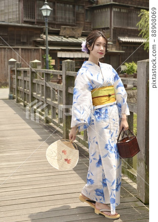 The streets of Little Edo Sawara and a young woman in a beautiful yukata The streets of Little Edo Sawara and a young woman in a beautiful yukata 88908069