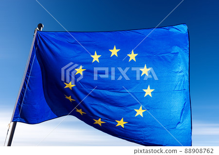 Close-up of an European Union Flag Waving in a Blue Sky Close-up of an European Union Flag Waving in a Blue Sky 88908762
