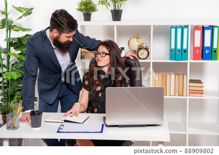 Happy professional man look eyes with woman working in office, co-workers 88909802