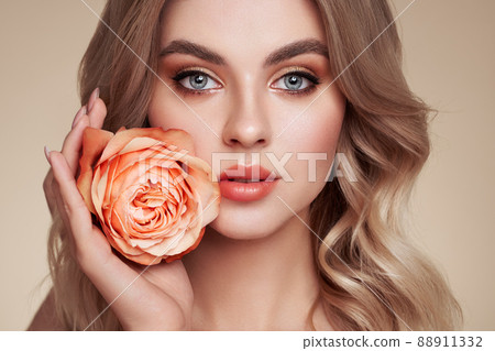 Beautiful young woman a rose flower Beautiful young woman a rose flower 88911332