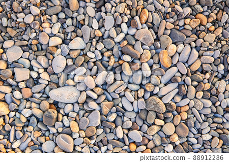 Colorful small pebbles or stone on sea pebble beach as background 88912286