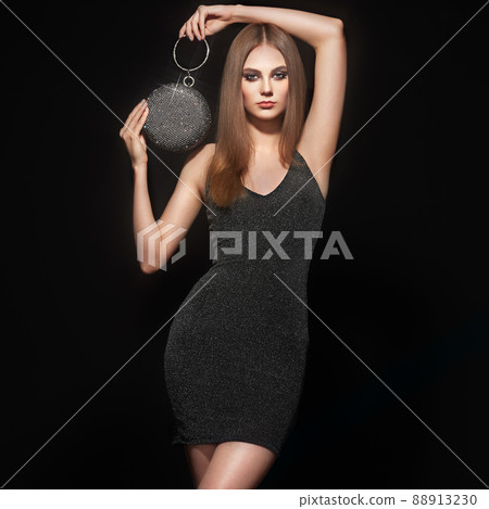 Blonde young woman in Little black dress 88913230