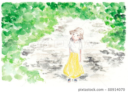 A woman looking up at the sky from under a tree 88914070