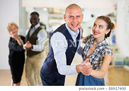 Man and woman dancing waltz in studio Man and woman dancing waltz in studio 88917400