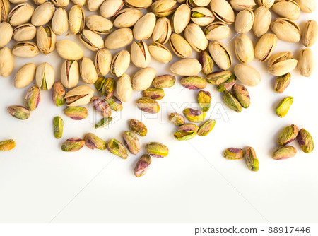 roasted pistachio nuts on a white background and place for inscription roasted pistachio nuts on a white background and place for inscription 88917446