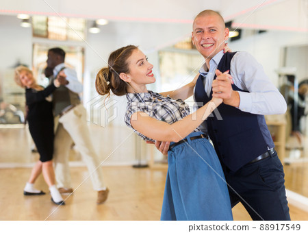Man and woman learning to dance classical ballroom dance 88917549