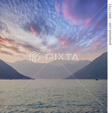 Sunset, beautiful landscape with silhouettes of trees. Travel concept. Montenegro, Kotor Bay. Sunset at Kotor Bay Montenegro. View of the sunset in Boko-Kotor Bay in Montenegro. Silhouettes of 88917701