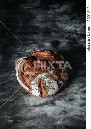 a kamut wheat bread loaf on a mottled surface a kamut wheat bread loaf on a mottled surface 88918454