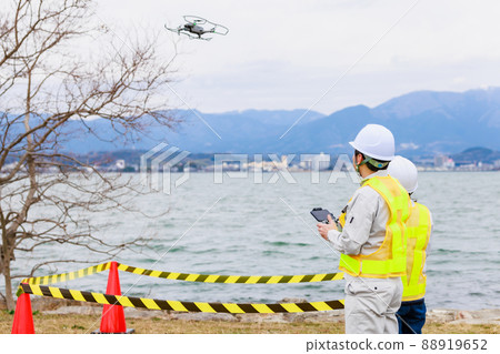 Workers operating drones 88919652