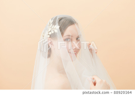 Veiled bridal beauty shot foreign woman 88920164