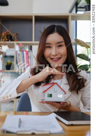 A woman holding and checking house model .Real Estate House Appraisal And Inspection and Insurance concept. 88922488