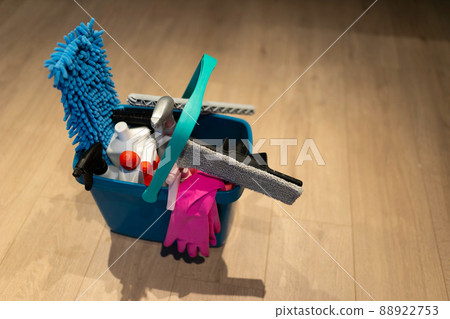Bucket of cleaning products on the floor Bucket of cleaning products on the floor 88922753