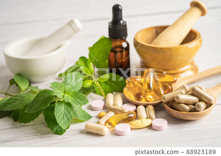 Alternative medicine herbal organic capsule drug with herbs leaf natural supplements for healthy good life. 88923189
