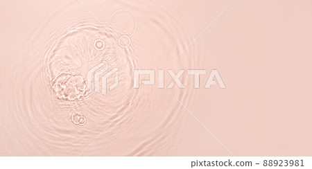 The texture of water on a pink background in bright sunlight. The texture of water on a pink background in bright sunlight. 88923981
