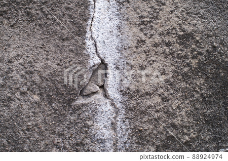 Deteriorated and cracked concrete slope 88924974