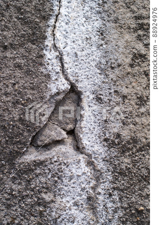 Deteriorated and cracked concrete slope Deteriorated and cracked concrete slope 88924976