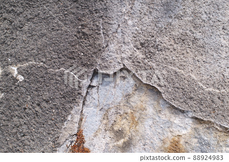 Deteriorated and cracked concrete slope 88924983