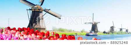 dutch windmill over river waters dutch windmill over river waters 88925248