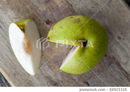 pear cut into pieces and slices during cooking pear cut into pieces and slices during cooking 88925326