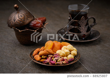 Dried fruits nut mix and arabic tea 88925807