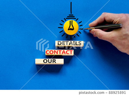 Our contact details symbol. Concept words Our contact details on wooden blocks. Businessman hand. Yellow light bulb icon. Beautiful blue background. Business our contact details concept. Copy space. Our contact details symbol. Concept words Our contact details on wooden blocks. Businessman hand. Yellow light bulb icon. Beautiful blue background. Business our contact details concept. Copy space. 88925891