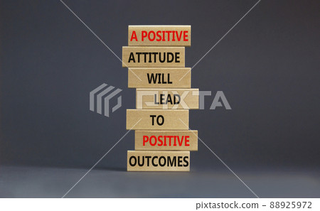 Think positive symbol. Wood blocks with words A positive attitude will come to positive outcomes. Beautiful grey background copy space. Business motivational think positive concept. 88925972