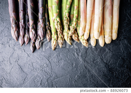 Green asparagus sprout on black board Green asparagus sprout on black board 88926073
