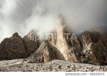 Incredible view of the Three Peaks of Lavaredo in morning fog Incredible view of the Three Peaks of Lavaredo in morning fog 88926074