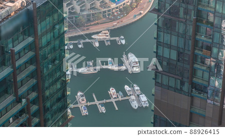Dubai Marina waterfront with promenade aerial timelapse, Dubai, UAE. Dubai Marina waterfront with promenade aerial timelapse, Dubai, UAE. 88926415