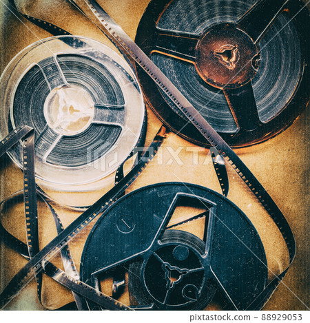 Old style film reels, vintage background with intentional grain, noise, dust and scratches 88929053