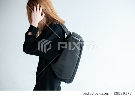 stylish hipster person holding modern backpack bag on white background 88929172
