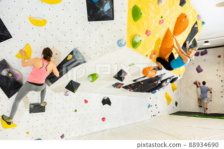 Climbing training on an artificial climbing wall indoor 88934690