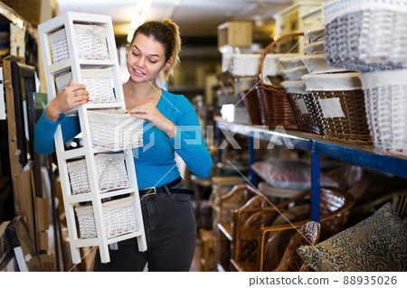 Young woman choosing nightstand with basket Young woman choosing nightstand with basket 88935026