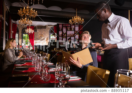 Man holding menu and ordering food 88935117