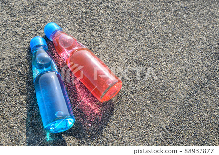 Bottled juice placed on the beach Retro sea 88937877