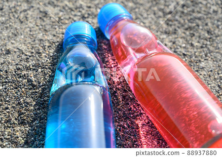 Bottled juice placed on the beach Retro sea Bottled juice placed on the beach Retro sea 88937880