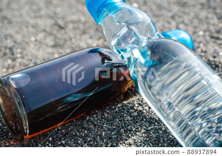 Bottled juice placed on the beach Retro sea 88937894