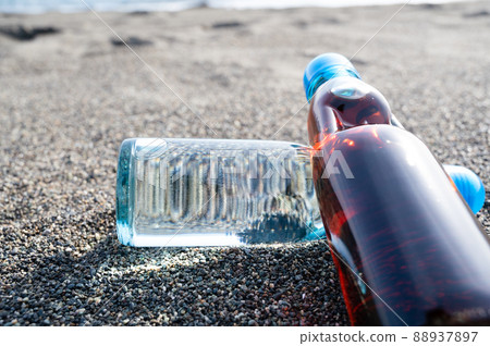 Bottled juice placed on the beach Retro sea Bottled juice placed on the beach Retro sea 88937897