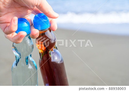 Bottled juice held in the sea Bottled juice held in the sea 88938003