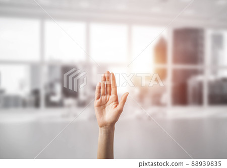 Choosing gesture of person in elegant modern interior in sunshine light Choosing gesture of person in elegant modern interior in sunshine light 88939835